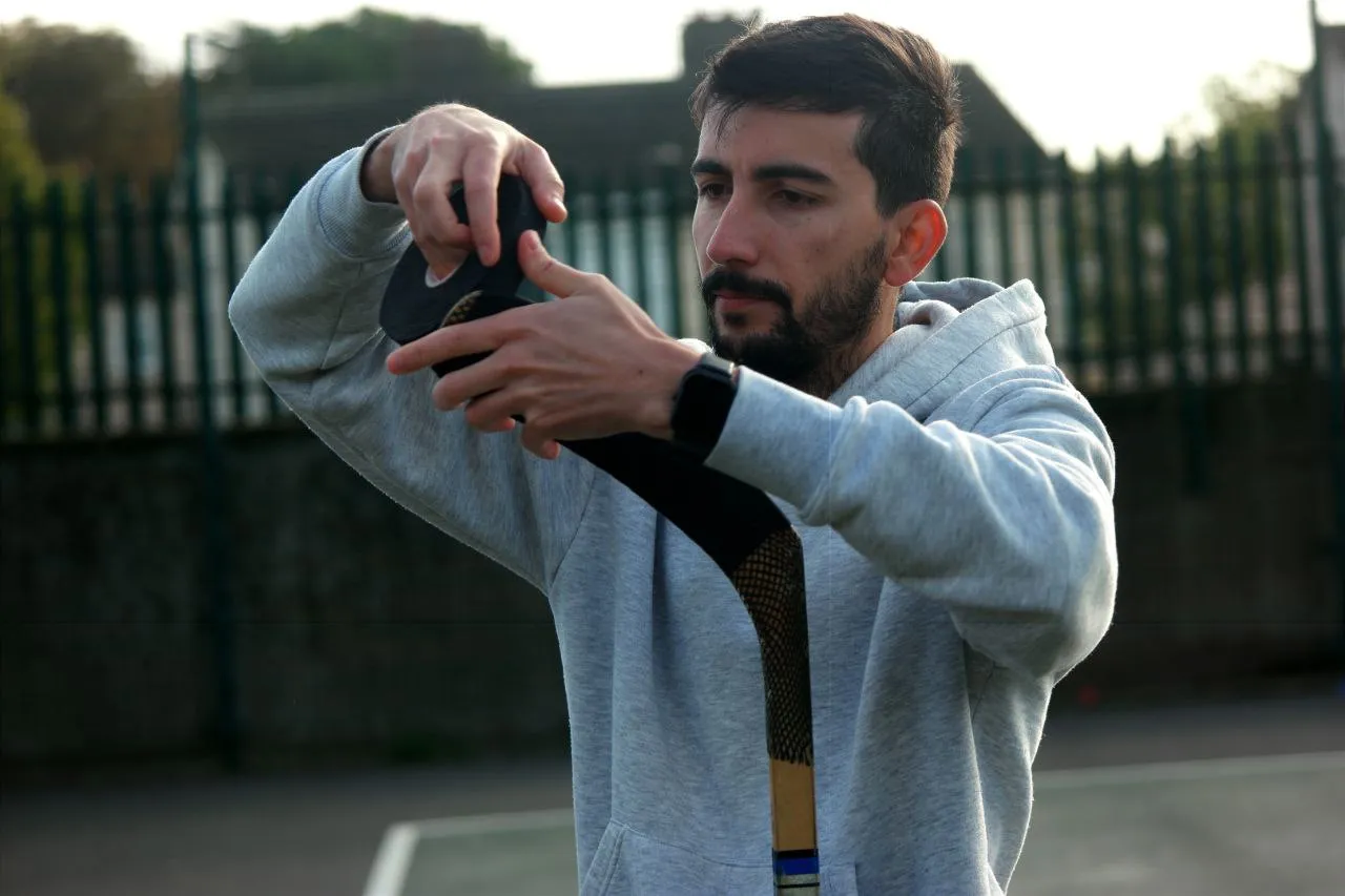 Manoel Lopes, Preparing his hockey stick for a game!